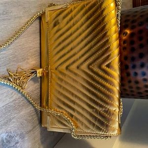 Bebe gold evening bag with metal details